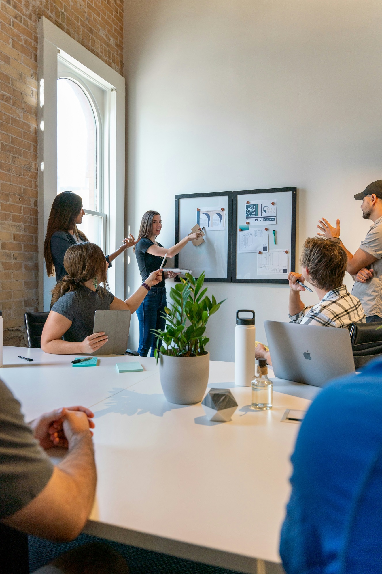 image of colleagues in a meeting room setting 